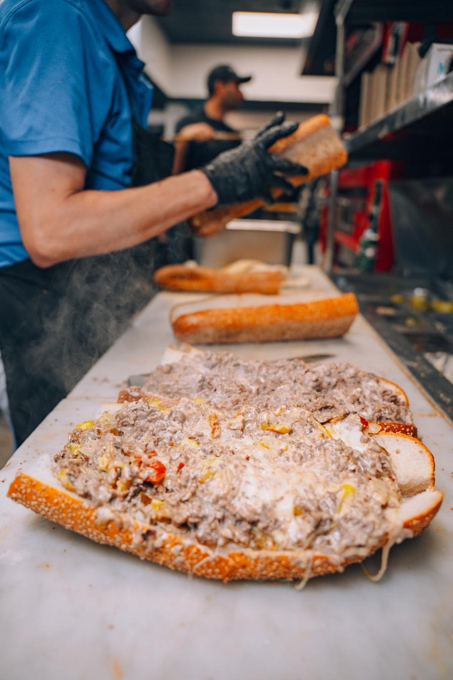 Steam rising off a fresh cheesesteak