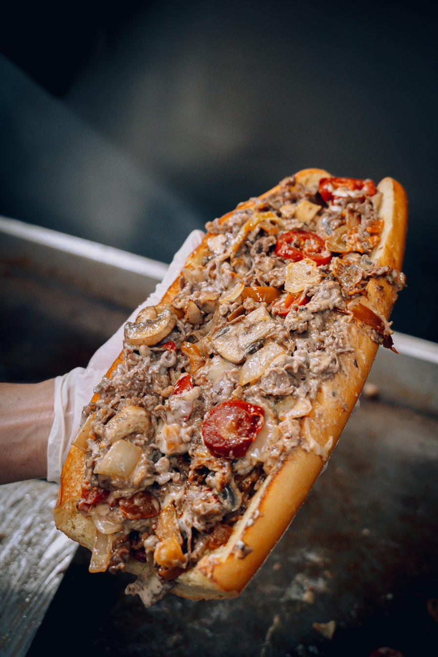 Stacked Philly cheesesteak hoagie