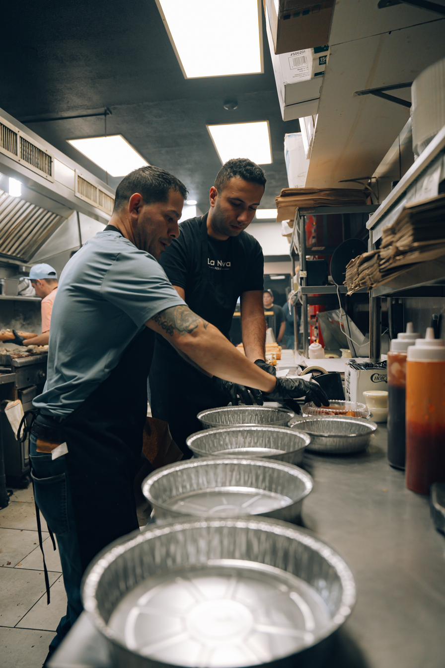 Team prepping wing trays